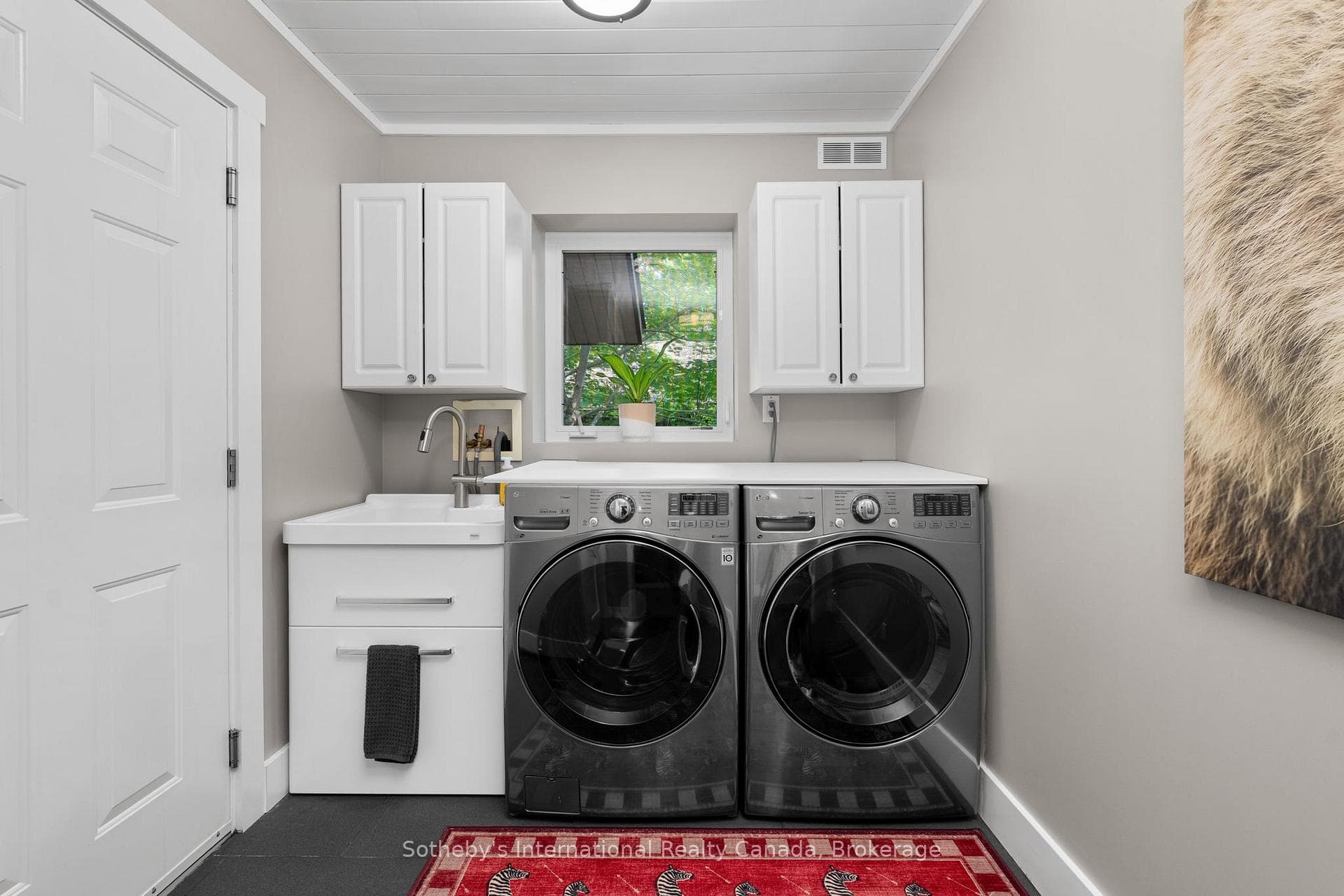 Main Floor Laundry Room. Access to Attached Garage