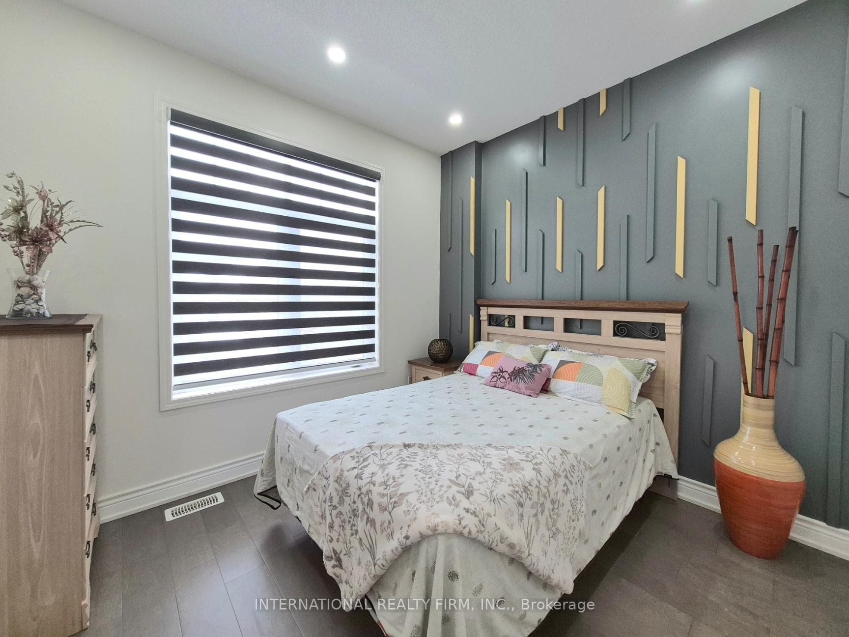 Bedroom on the main floor with custom accent wall