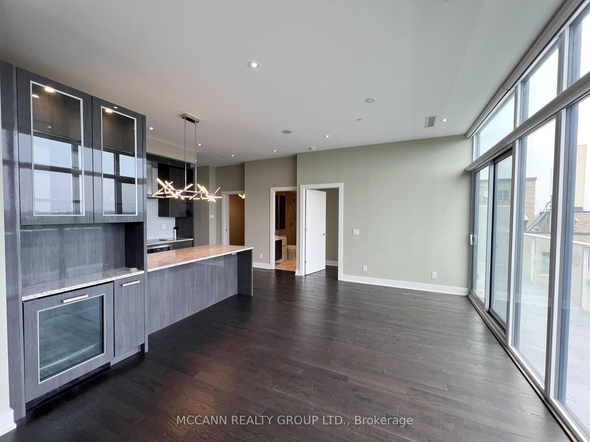 Living room + dining room area with balcony access