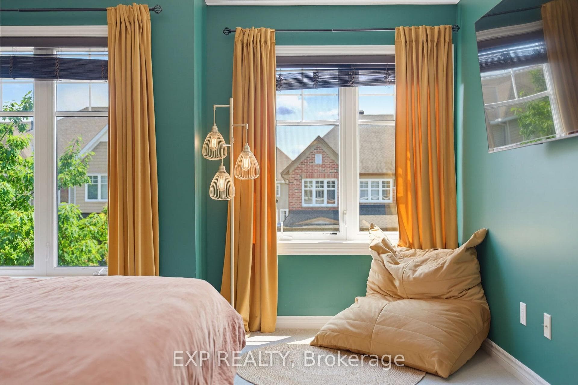 Primary Bedroom With A Cozy Sitting Area.