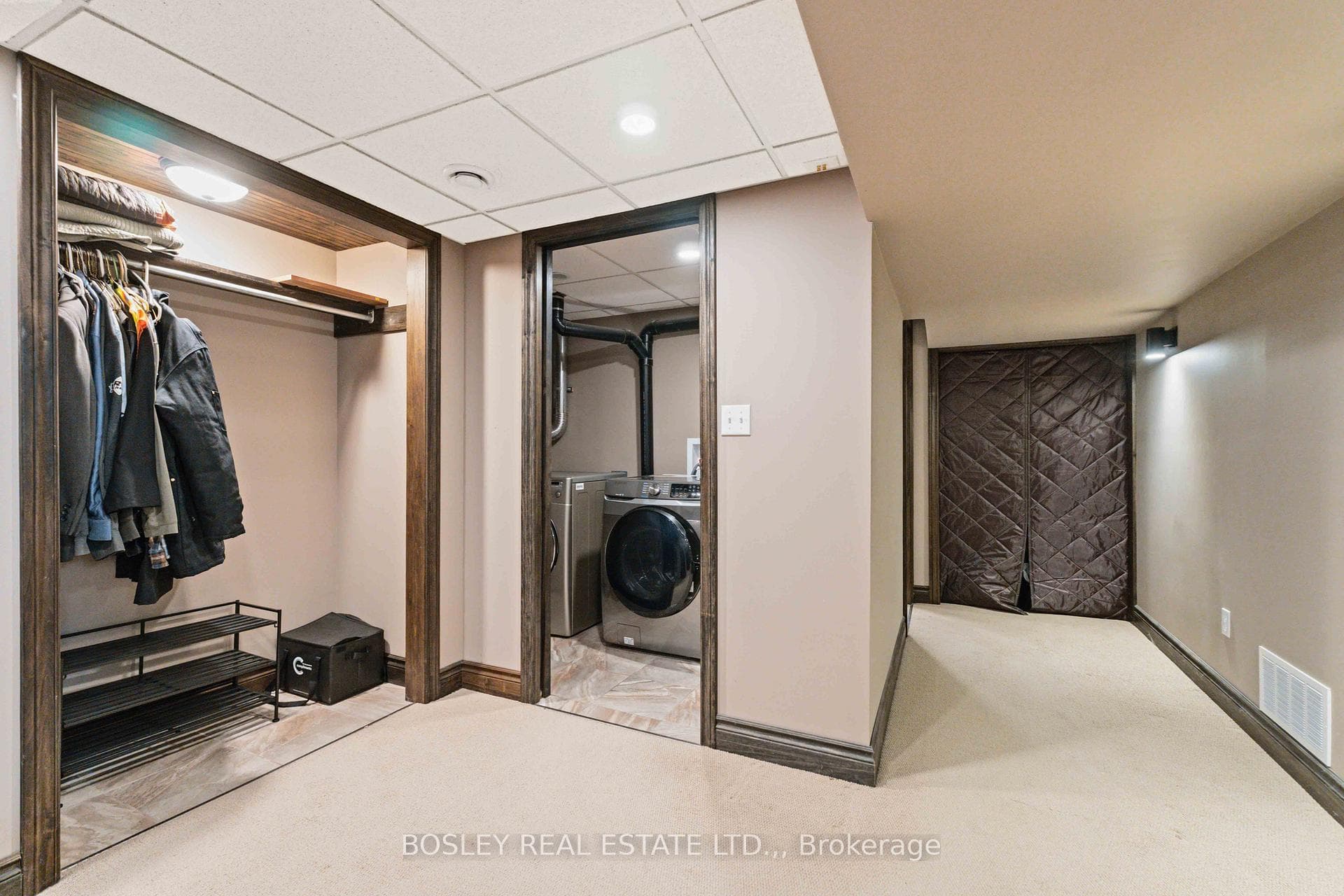 Laundry and storage closet in lower level