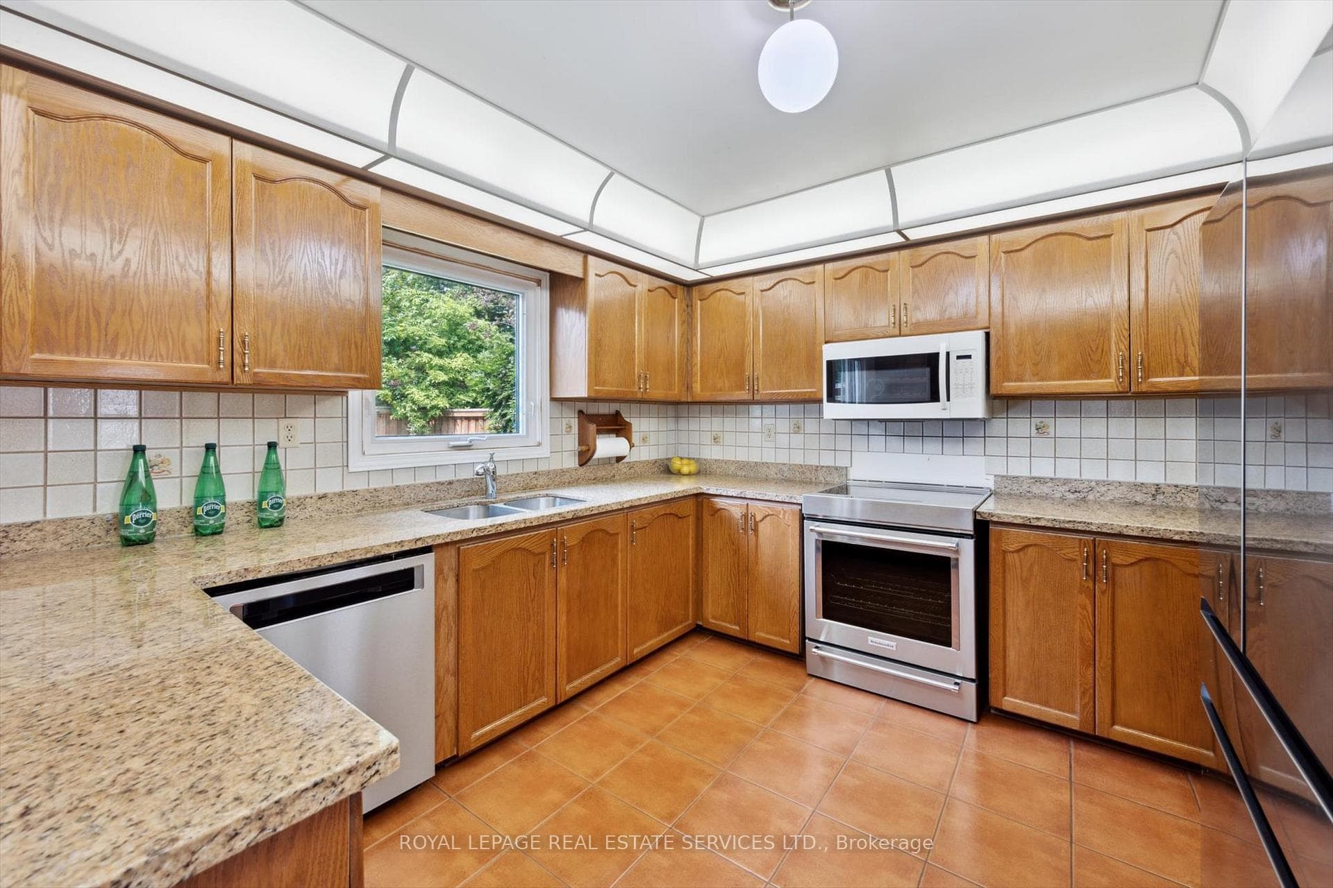 Gourmet Kitchen Features Granite Countertops