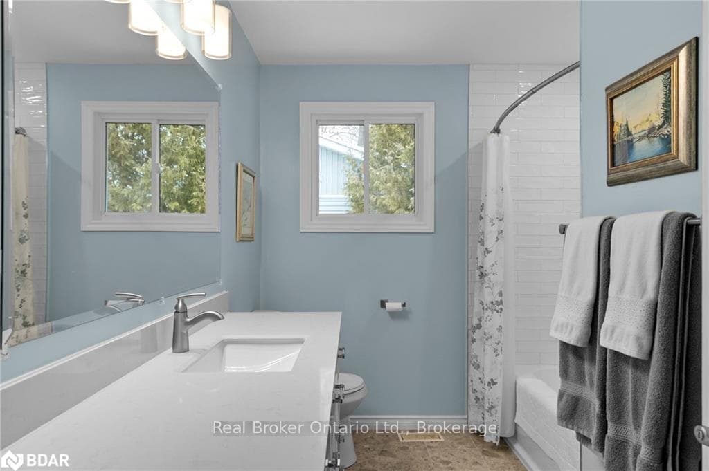 Full bathroom featuring vanity, shower / bath comb