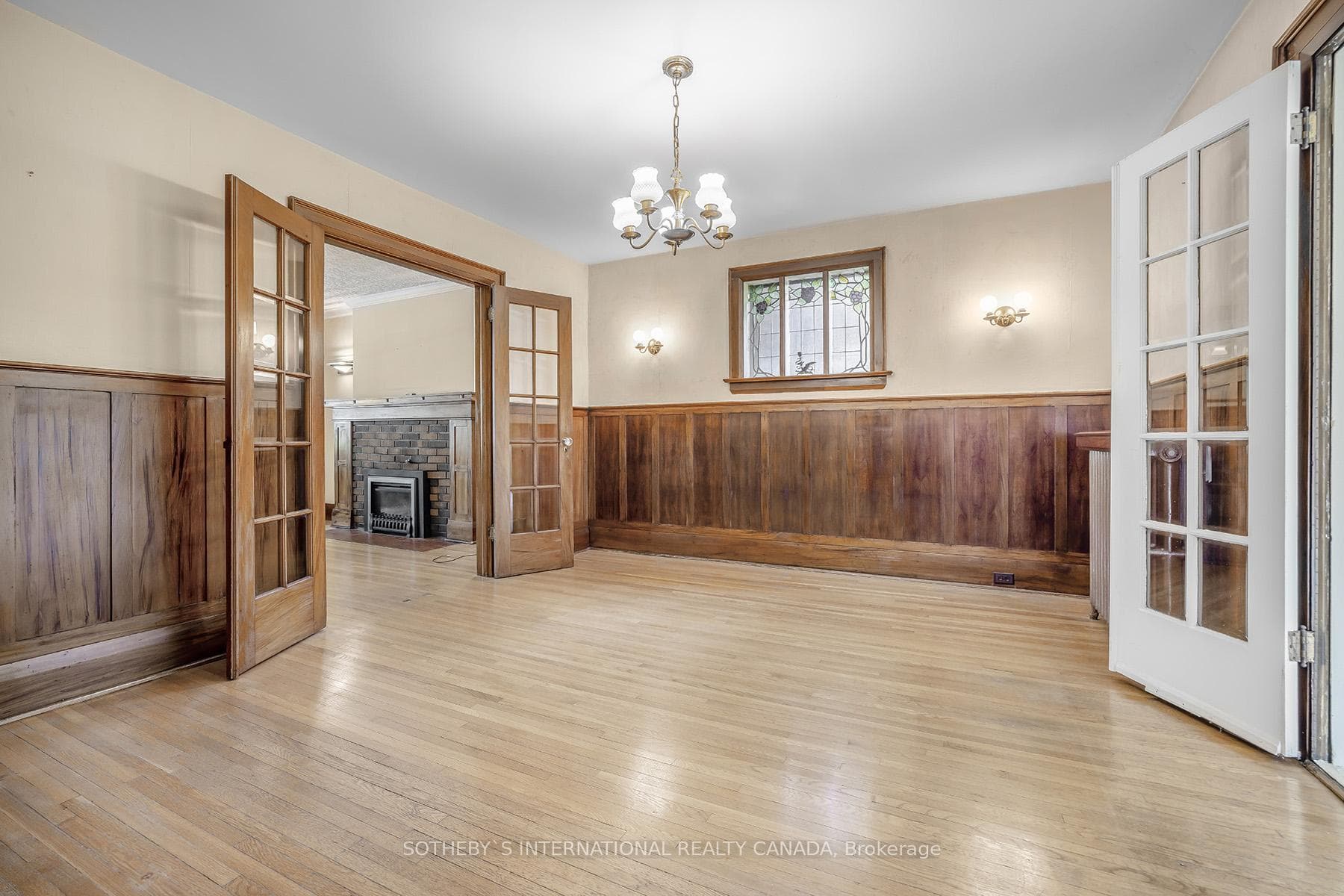 Dining room with wainscoting and hardwood