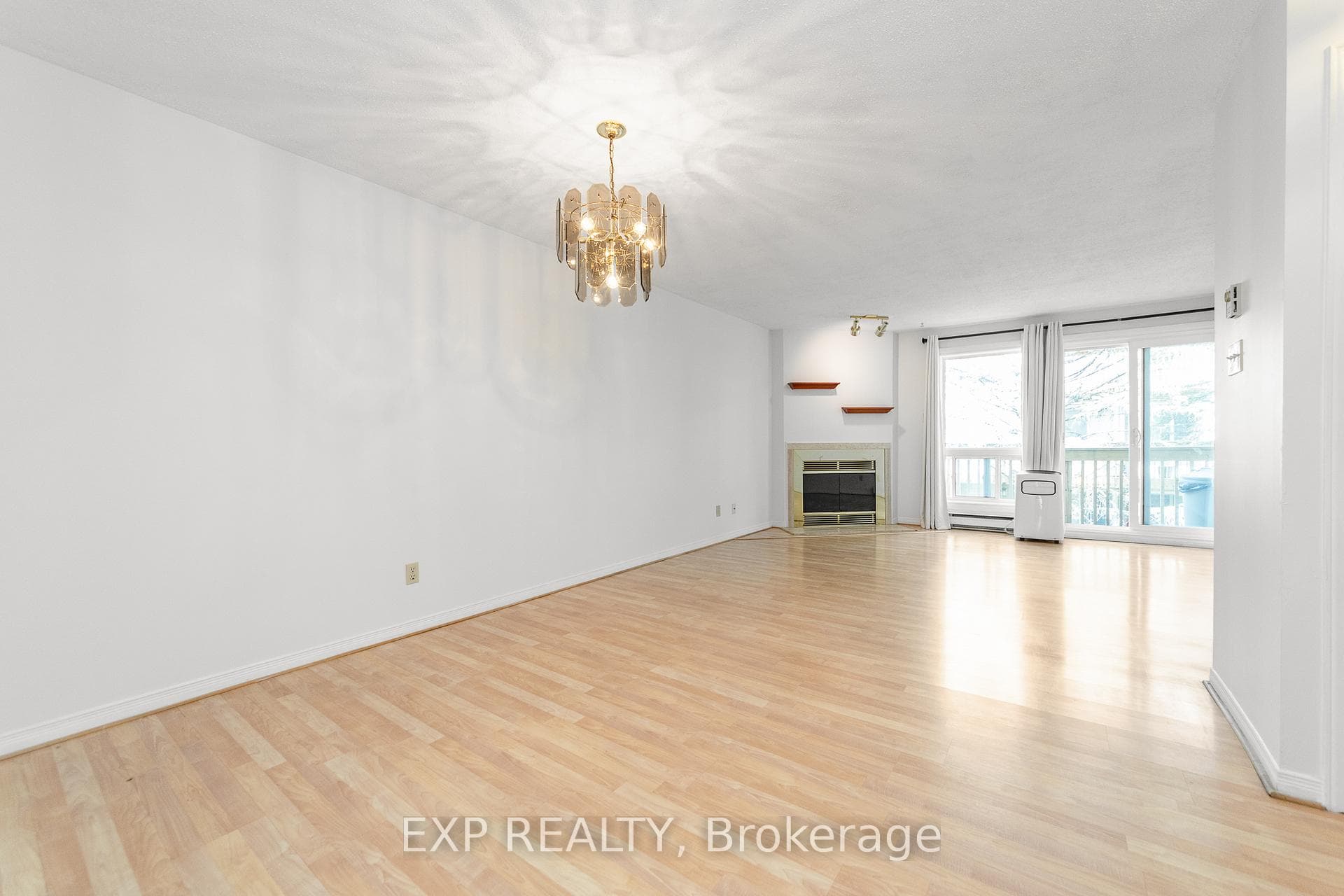 Wood Fireplace in Living/Dining Room