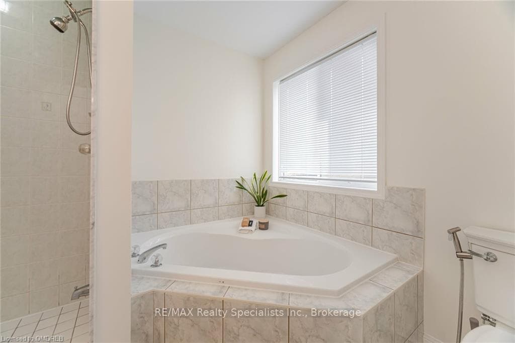 Bathroom with plus walk in shower and toilet