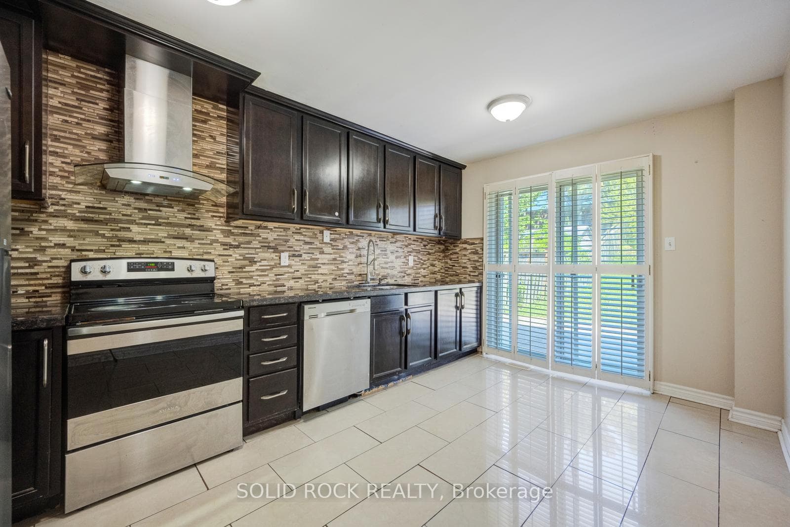 Kitchen w/ eating area + Patio door