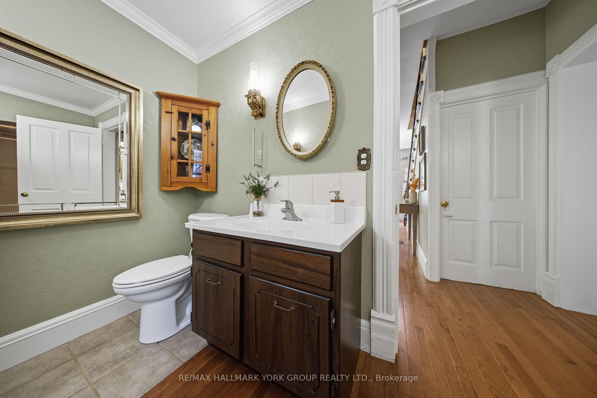 Bathroom With Hardwood & Crown-Moulding