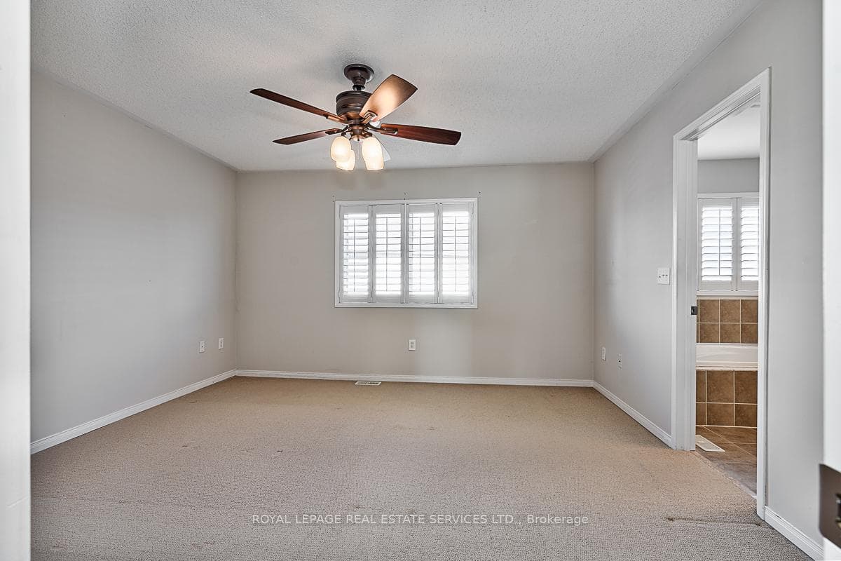 Primary Bedroom w/4-Piece Ensuite & Walk-In Closet