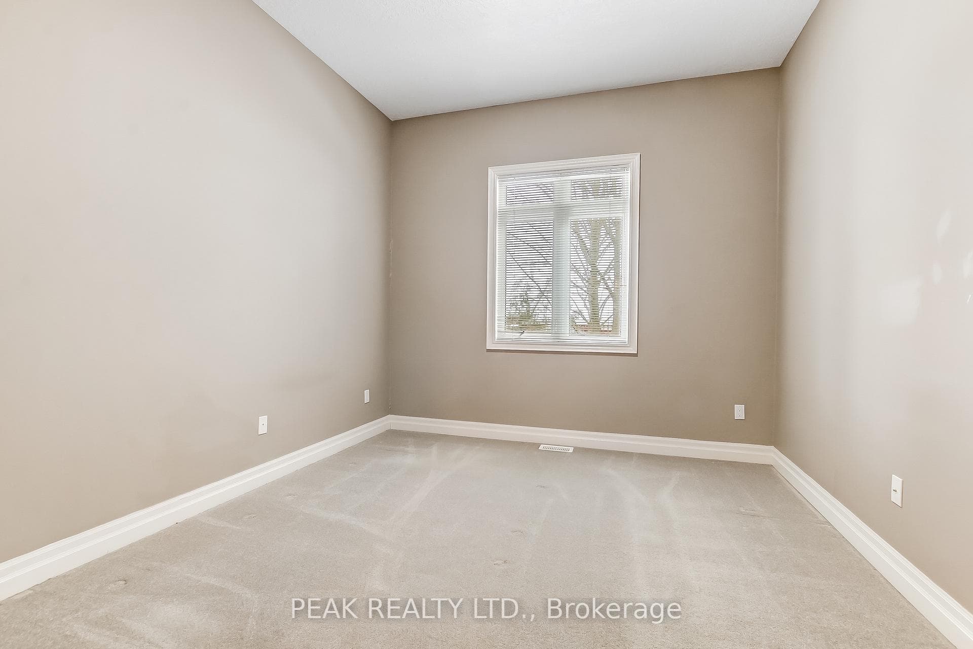 Primary bedroom, large east facing window.