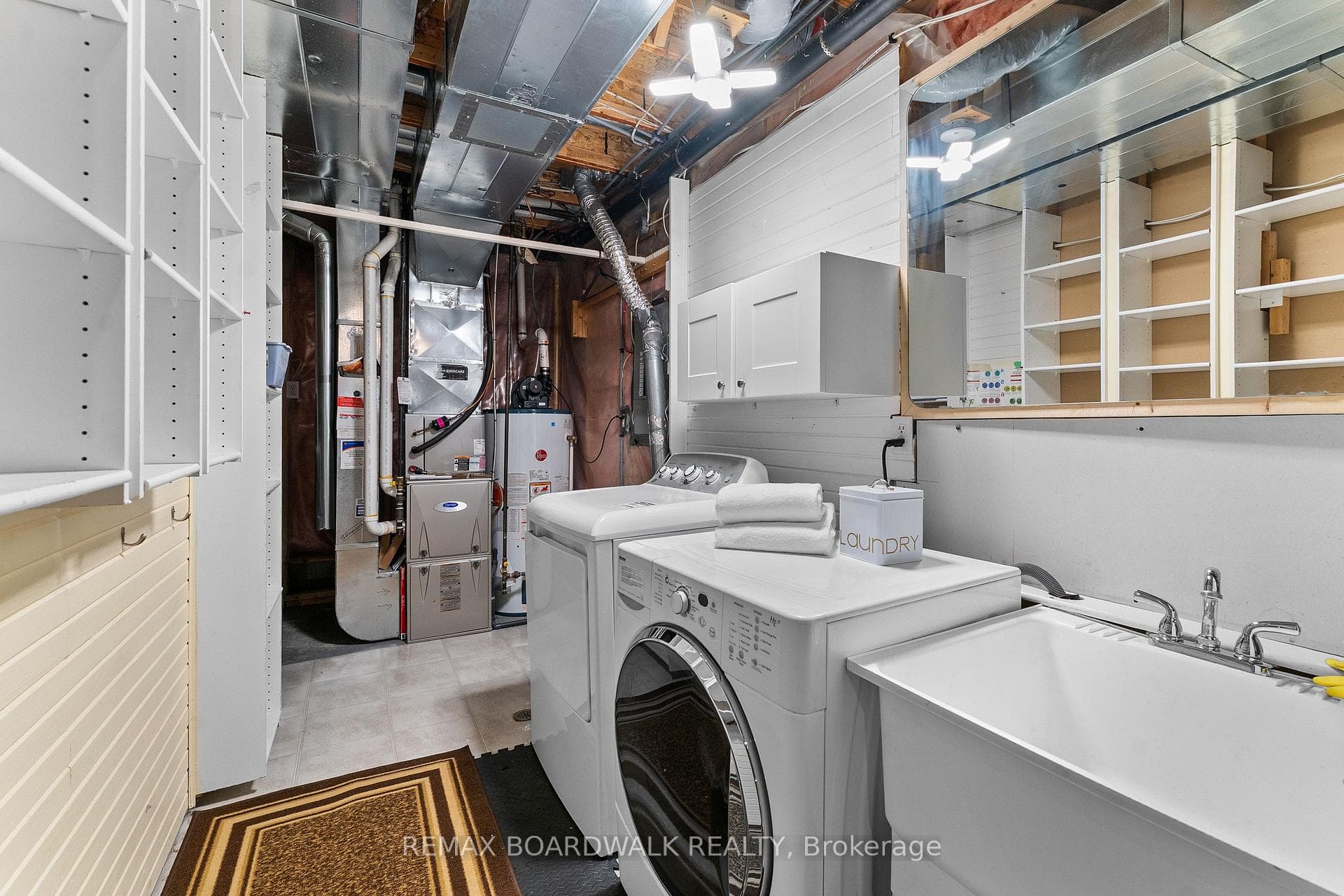 Utility room with laundry and laundry sink