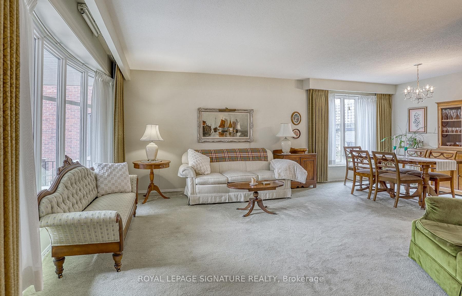 Generous living room with a large bow window