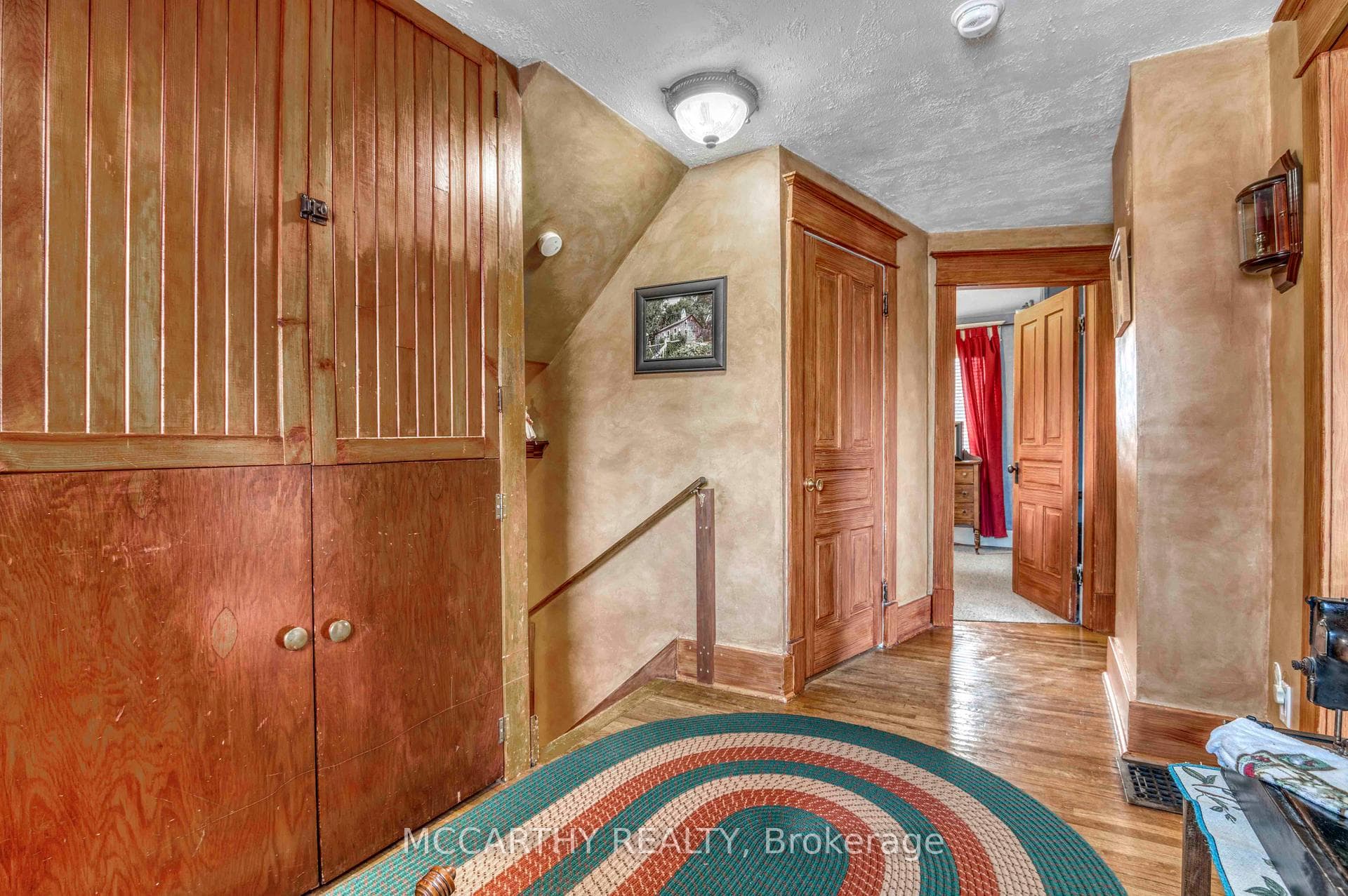 Upstairs hall way with built in cabinets