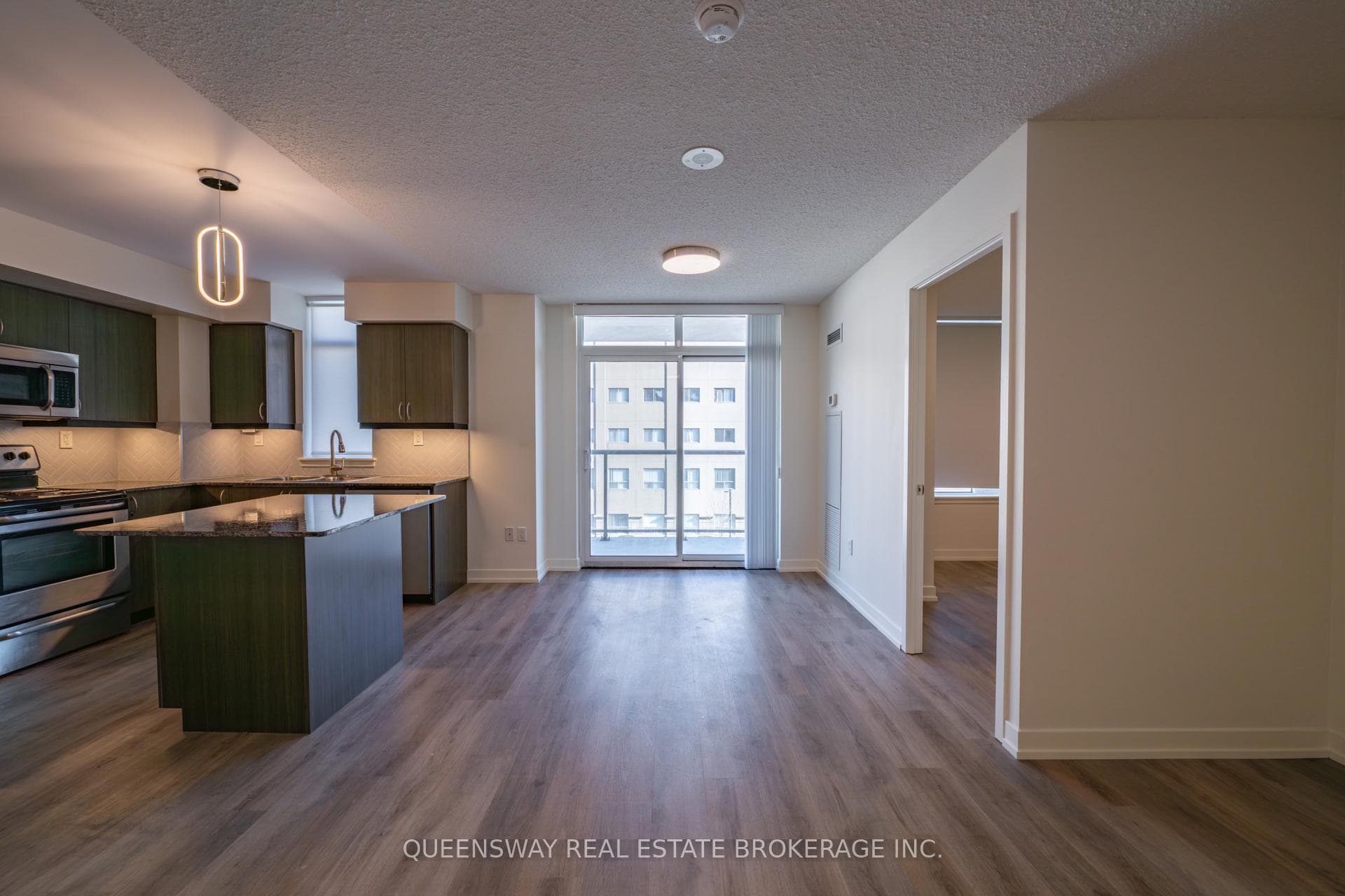 Living Room - Facing Balcony / Kitchen