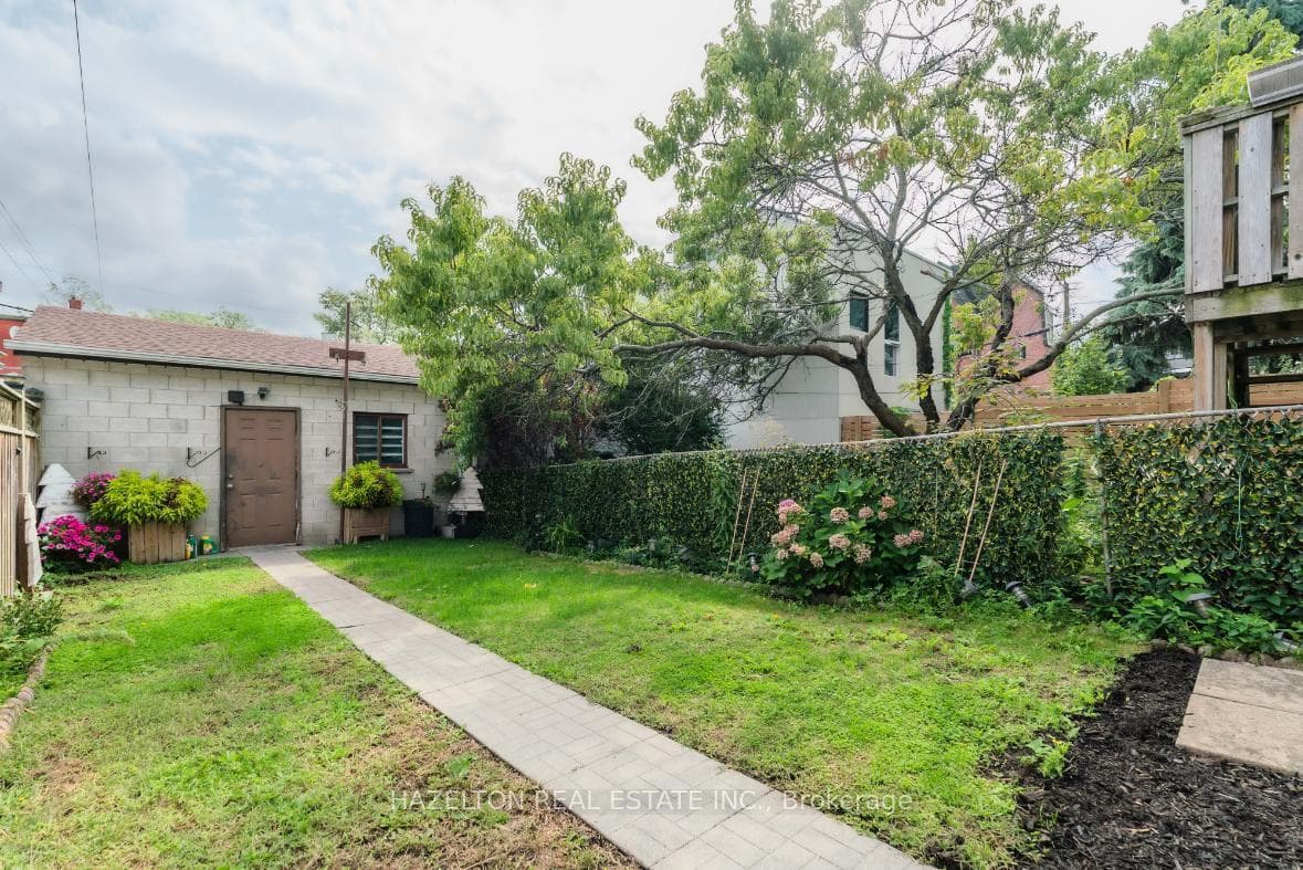 Backyard Leading to Double Car Garage