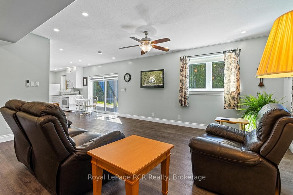 Living room or rec-room space with patio walkout
