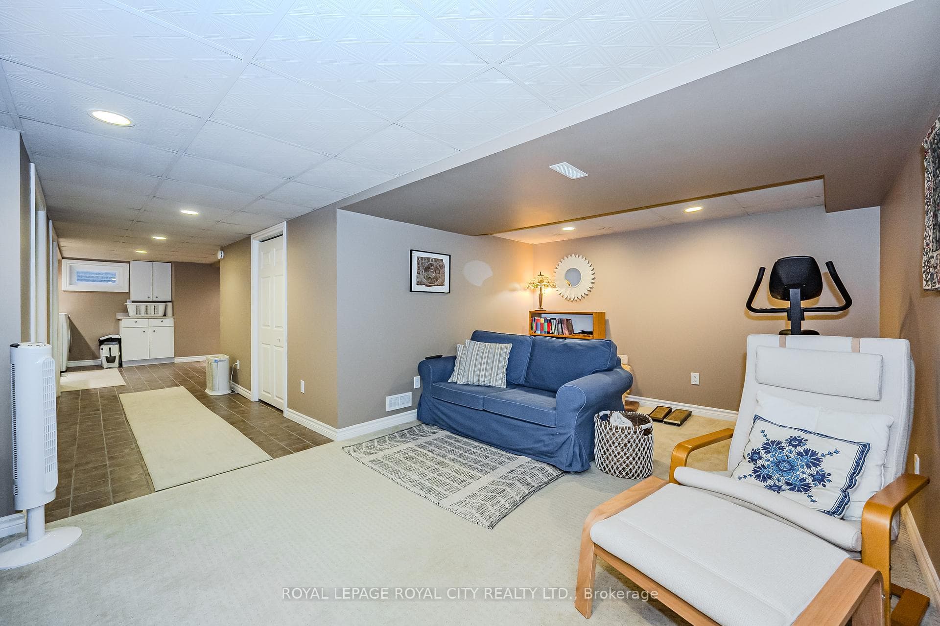 Wide hallway opens to storage and utility room.