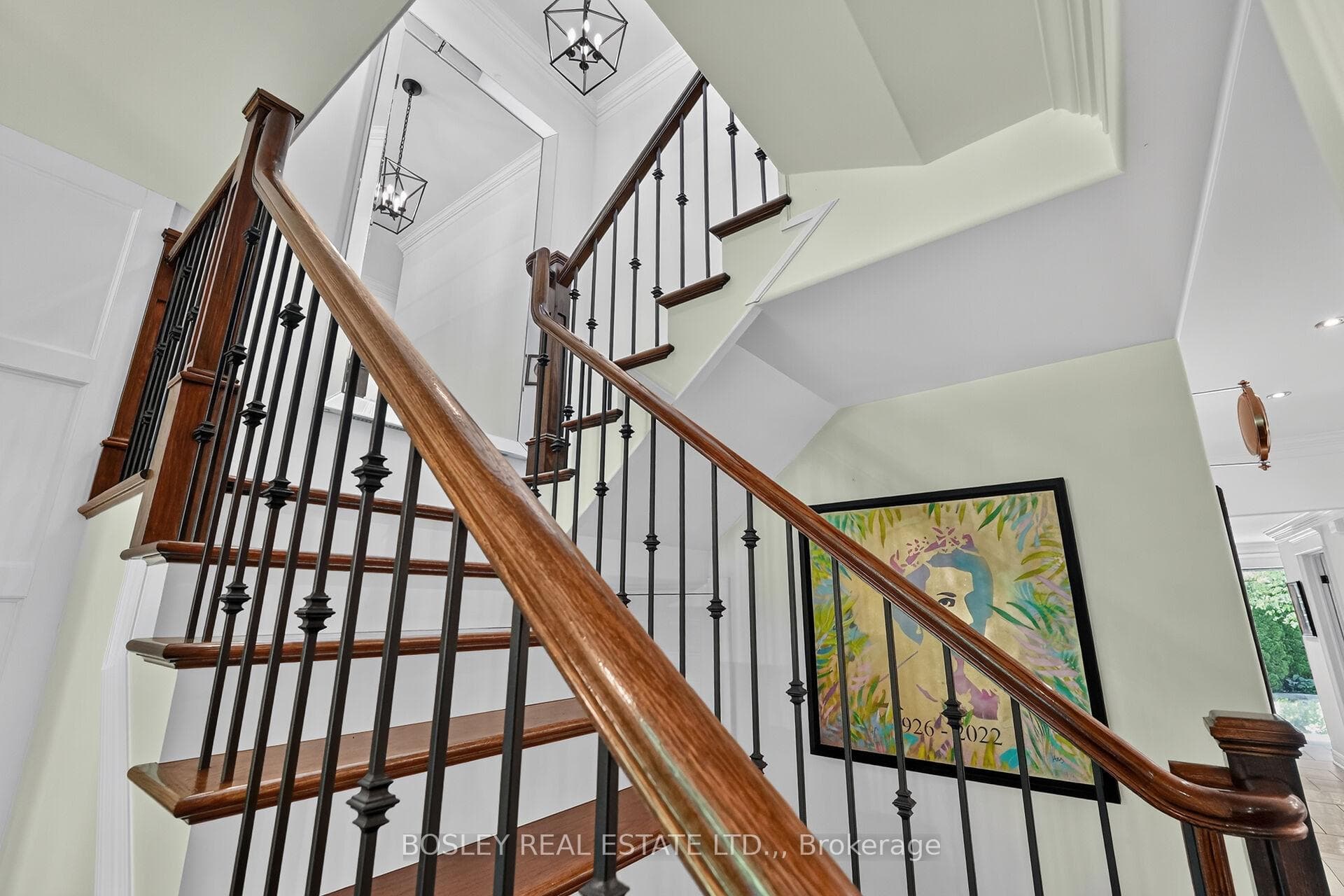 Elegant stairway with wrought iron balusters