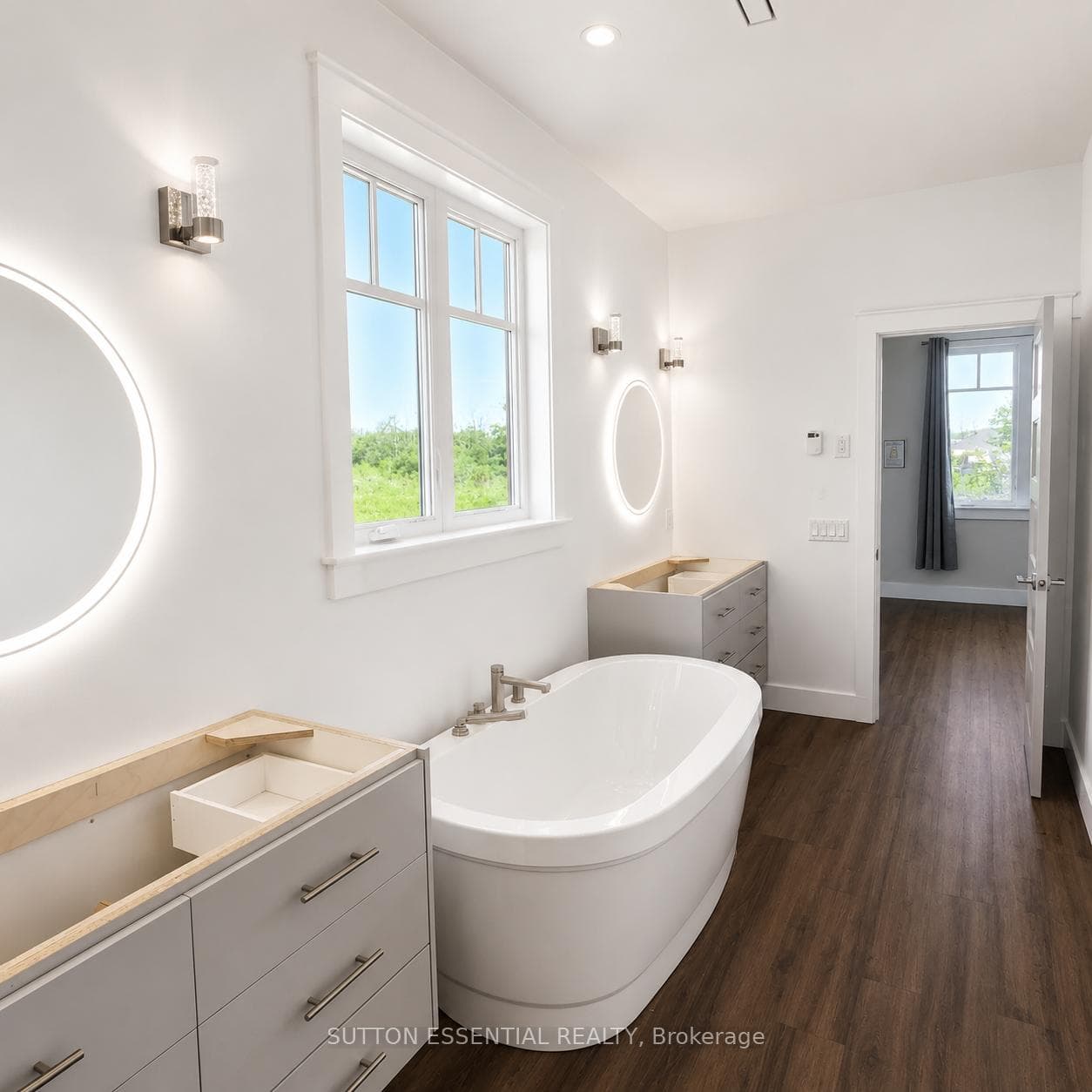 Ensuite with dual floating vanities & soaker tub