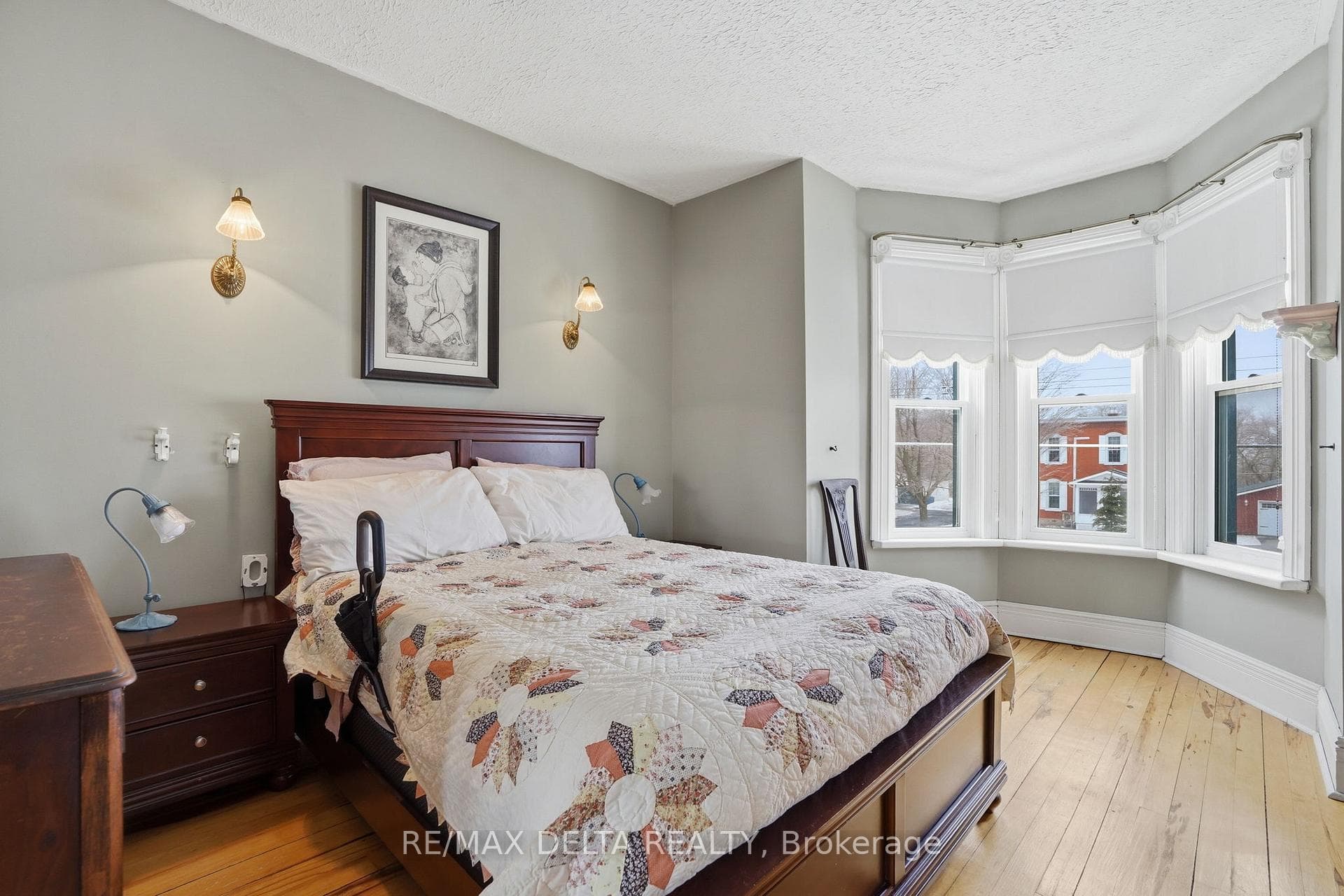 Primary bedroom with bay window.