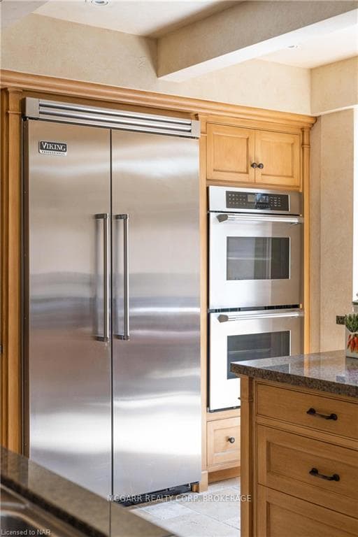 Two ovens. Viking fridge and freezer