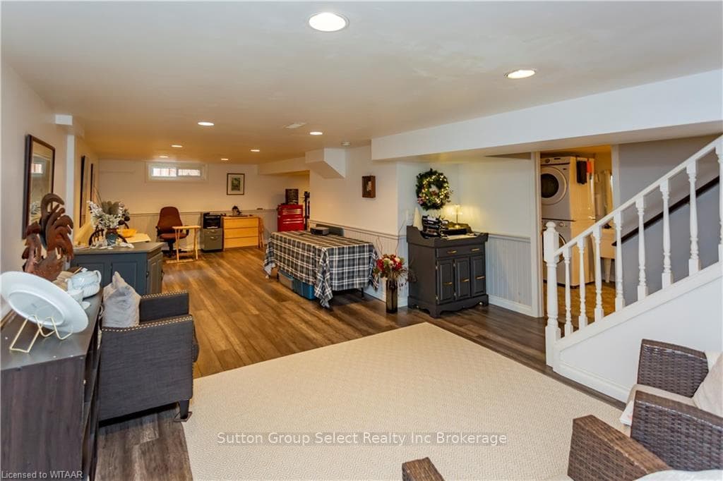 Living room featuring dark wood-type flooring and