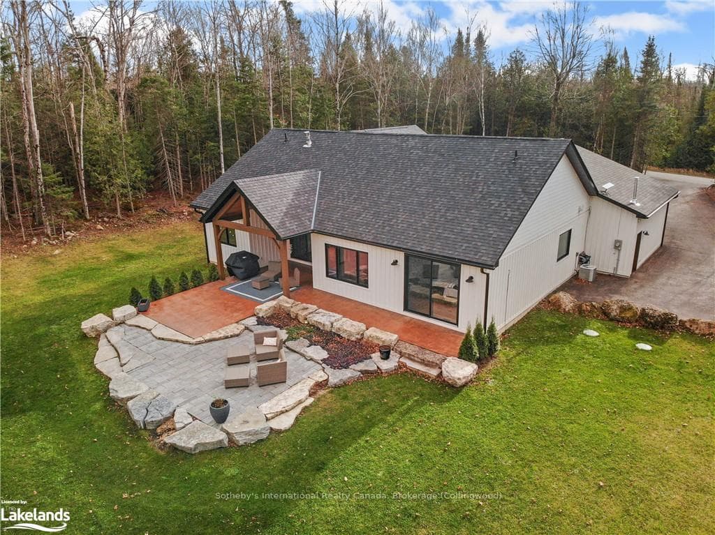 Back of house with a yard, a patio, and an outdoor