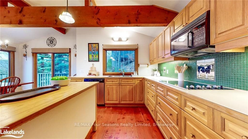 Kitchen featuring plenty of natural light, hanging