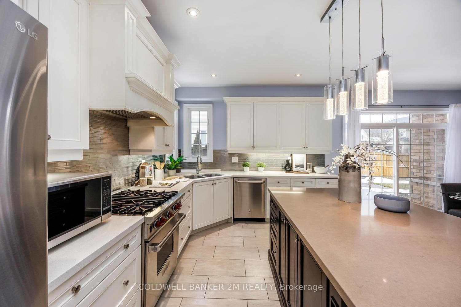 Wolf and GE Cafe stainless steel appliances