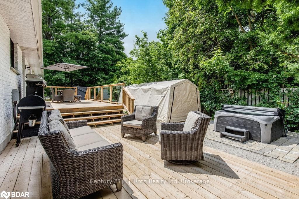 Wooden deck featuring a shed