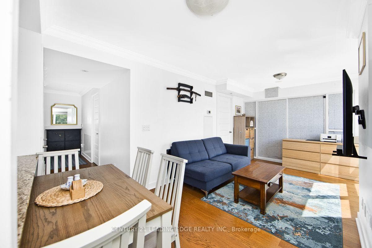 Bright Living/Dining Area w/ Crown Moulding
