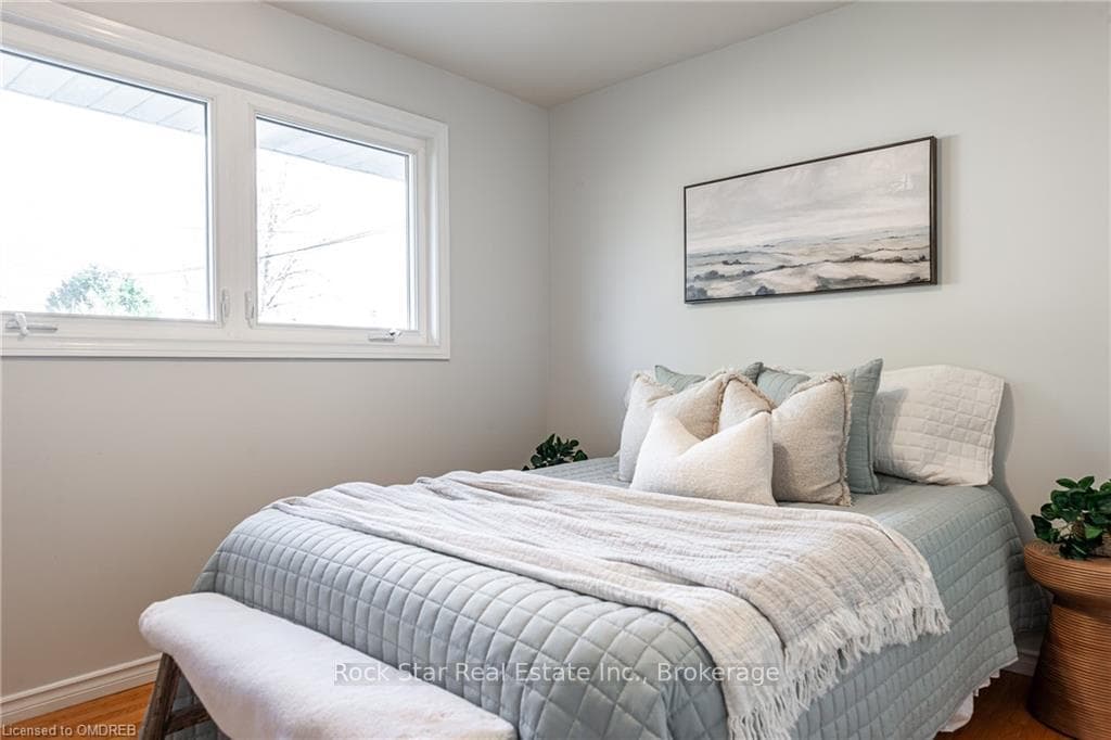 Bedroom featuring wood-type flooring
