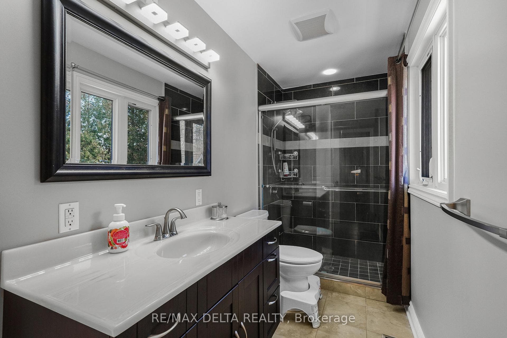 Modern second level bathroom w/glass shower.