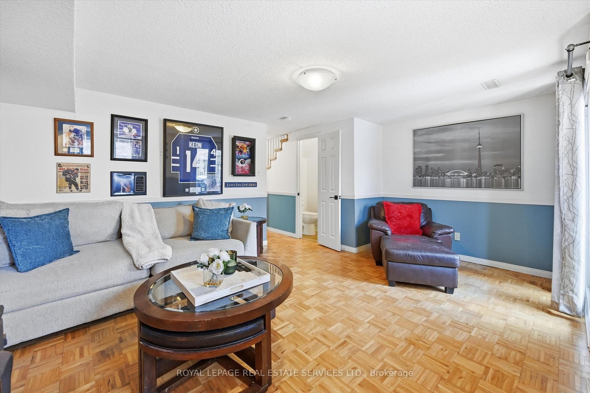 Large Family Room Offering Parquet Flooring