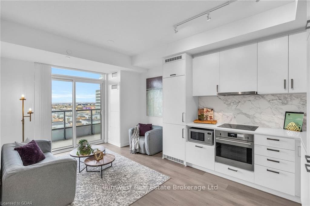 Kitchen featuring stainless steel appliances, whit