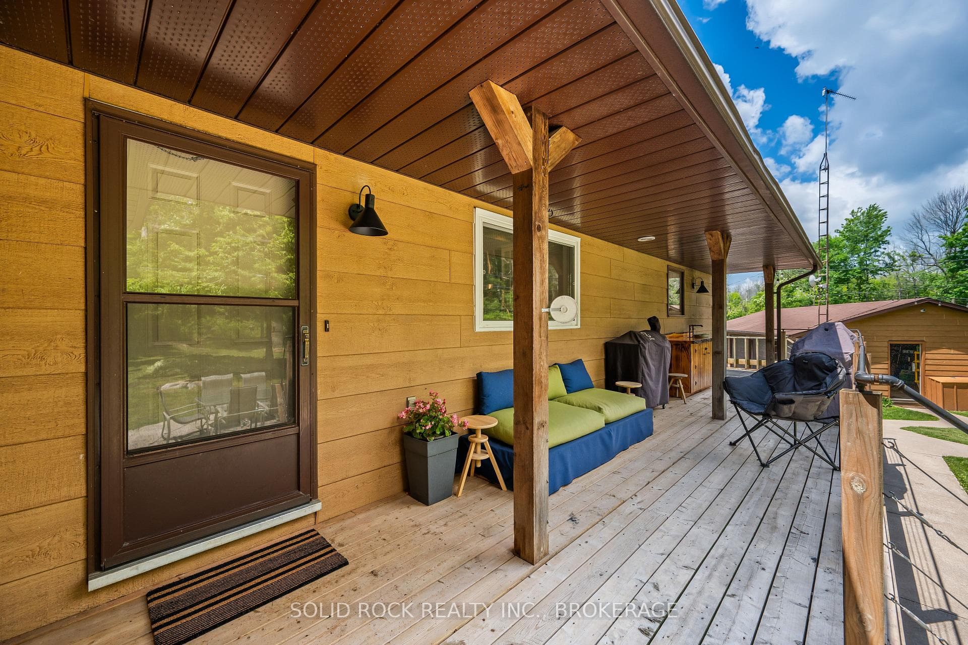 Back covered porch with live edge counter and sink