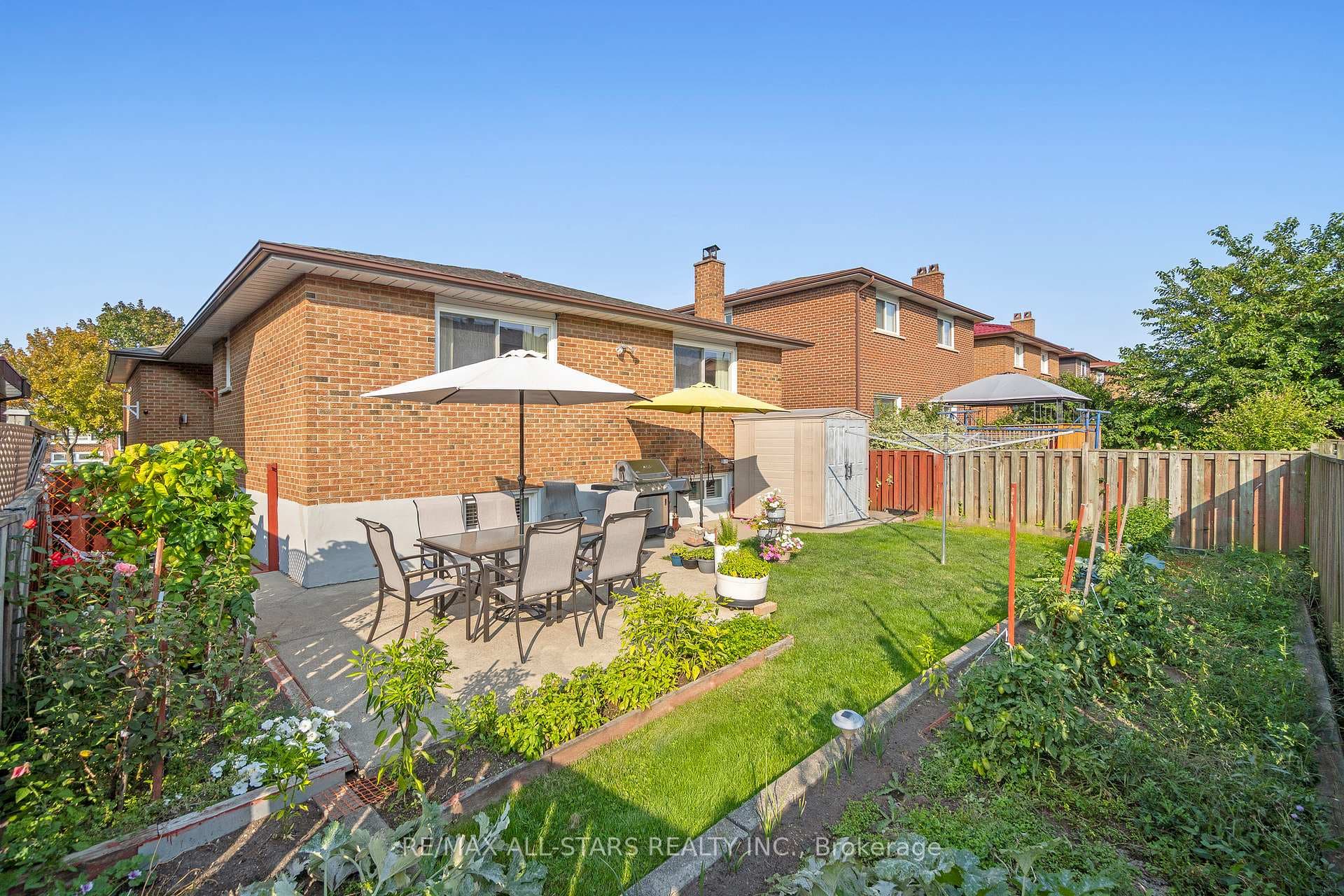 Beautiful yard w patio, shed, bbq hookup, gardens