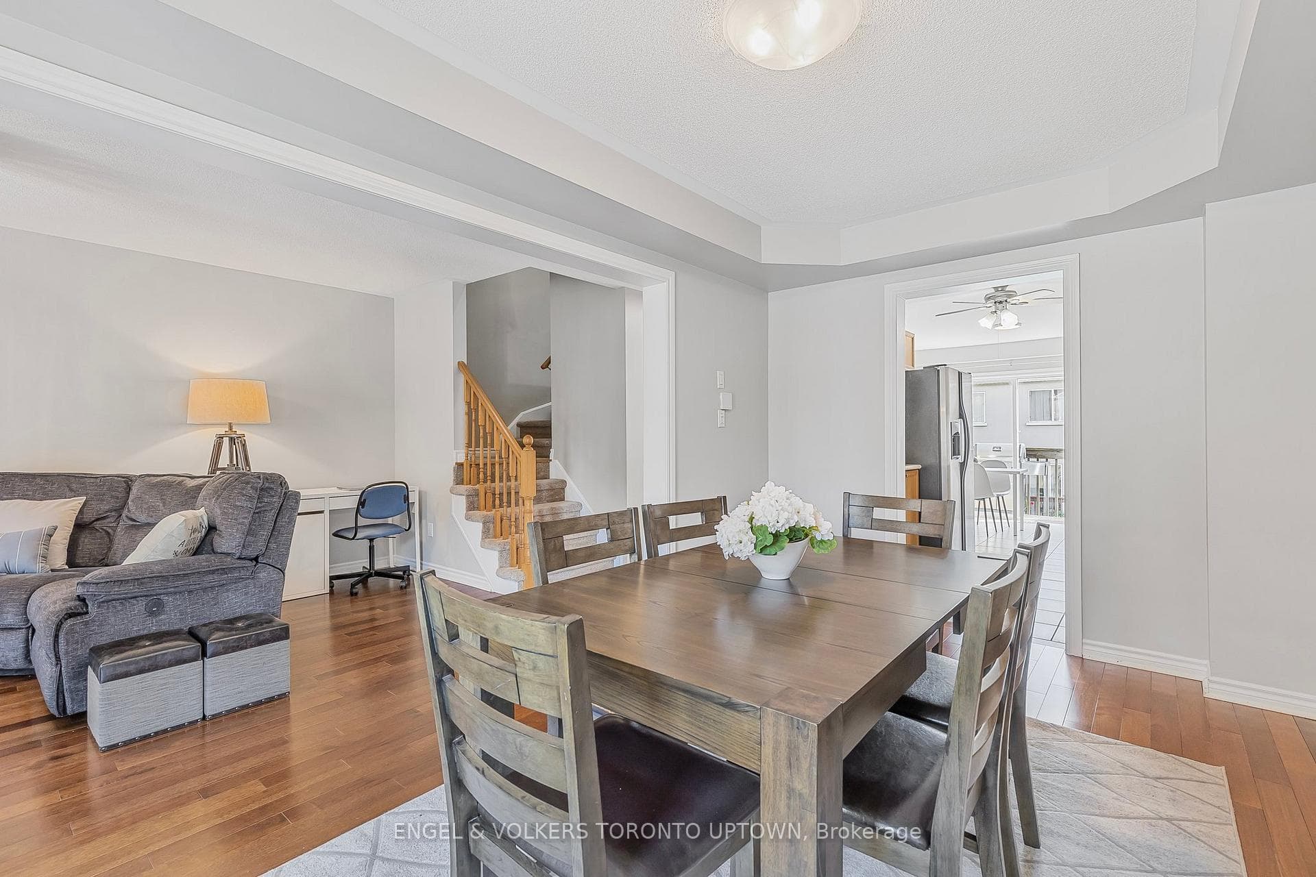 Open concept dining room with hardwood flooring