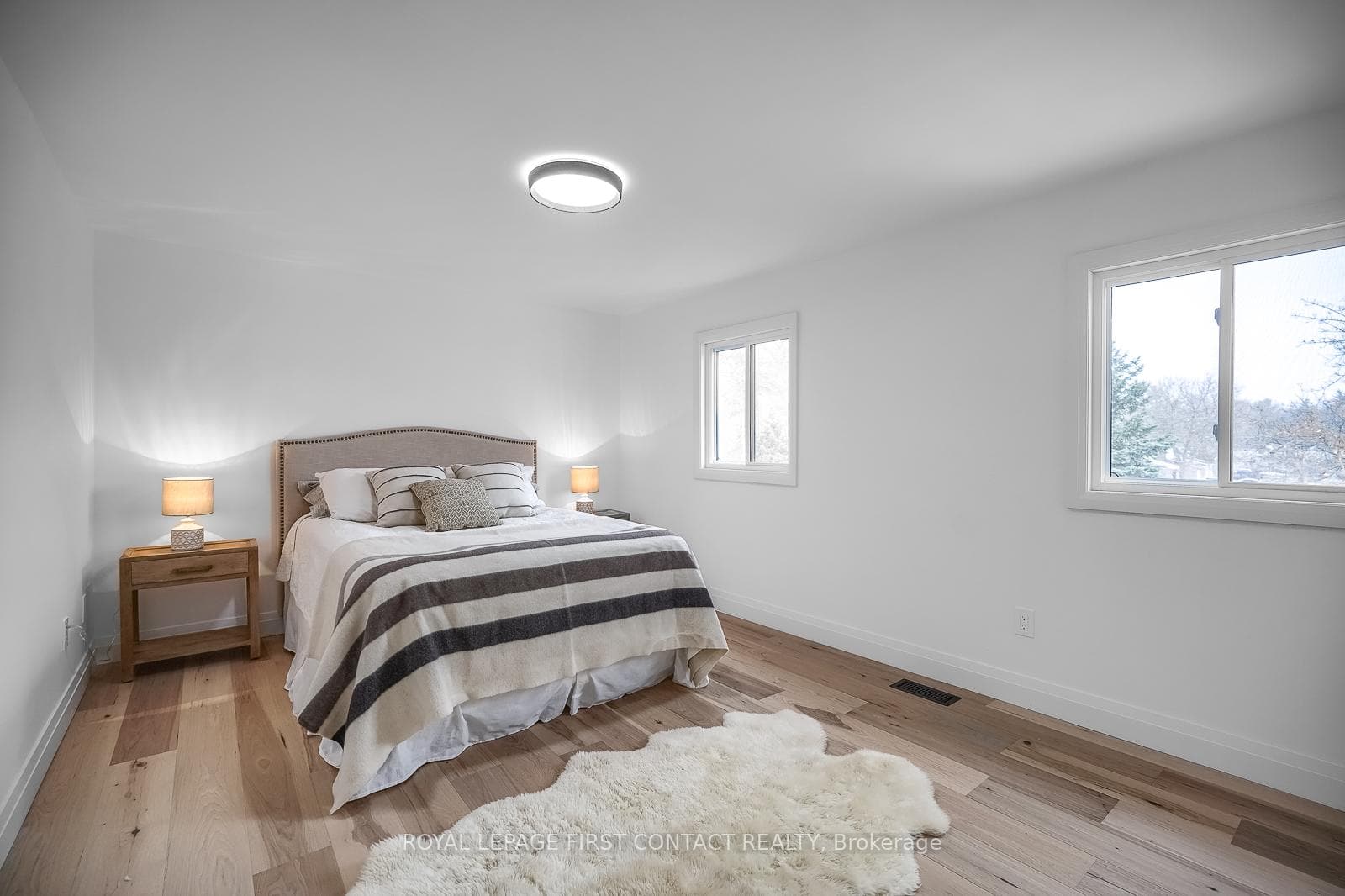 Spacious primary can easily handle a kingsize bed