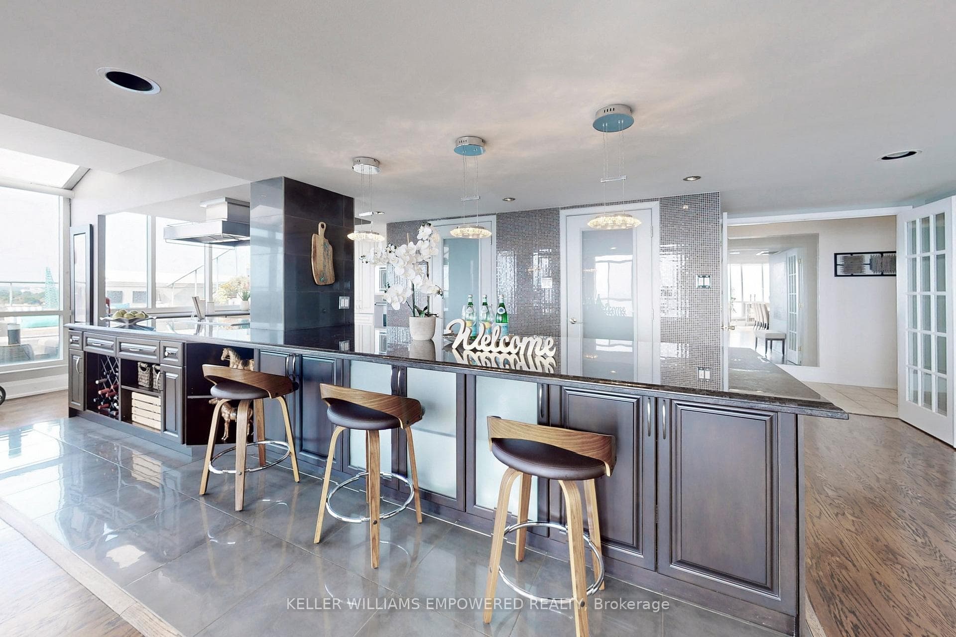 An extensive 18.5 ft wide Island w/ breakfast bar