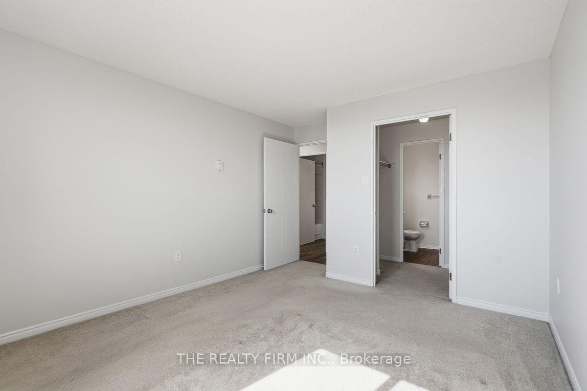 Master bedroom with view of walk through closet