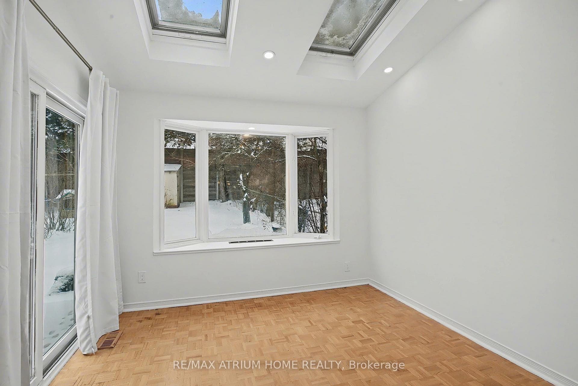 Sunroom With Skylights & Pot Lights