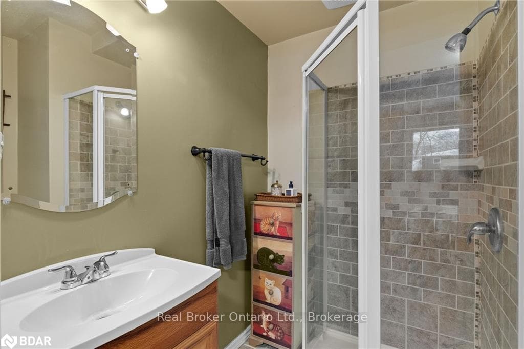 Bathroom with vanity and an enclosed shower
