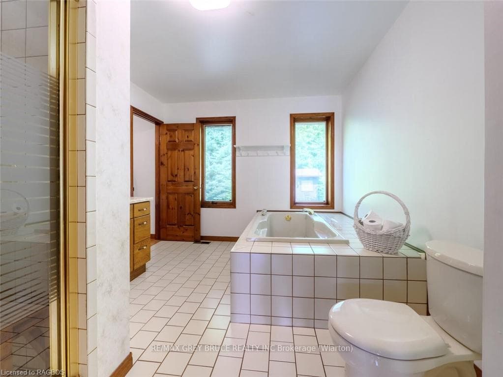 Main floor bathroom with separate shower and tub