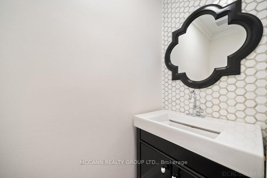 Powder room with marble feature wall