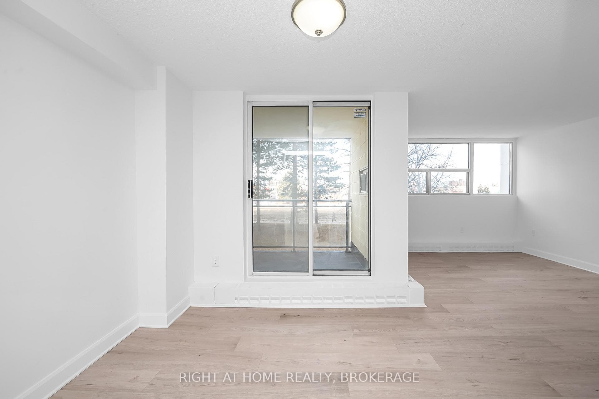 Living Room/ Dining Room with Entrance to Balcony