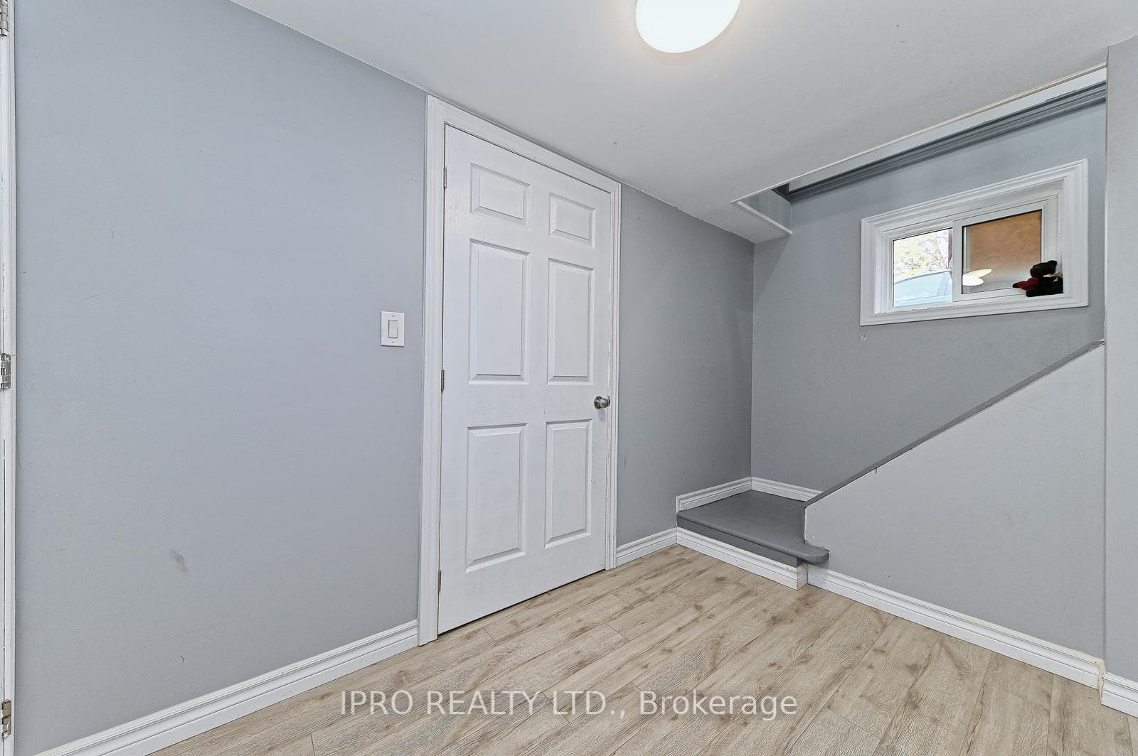 Lower-shared laundry area & access to utility room