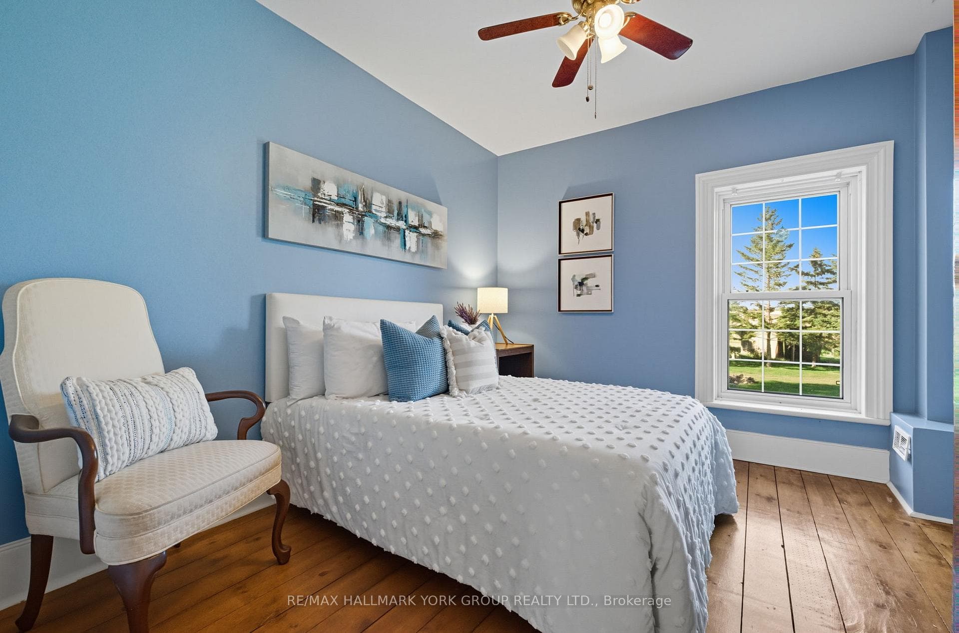 Bright Bedroom With Hardwood Floors