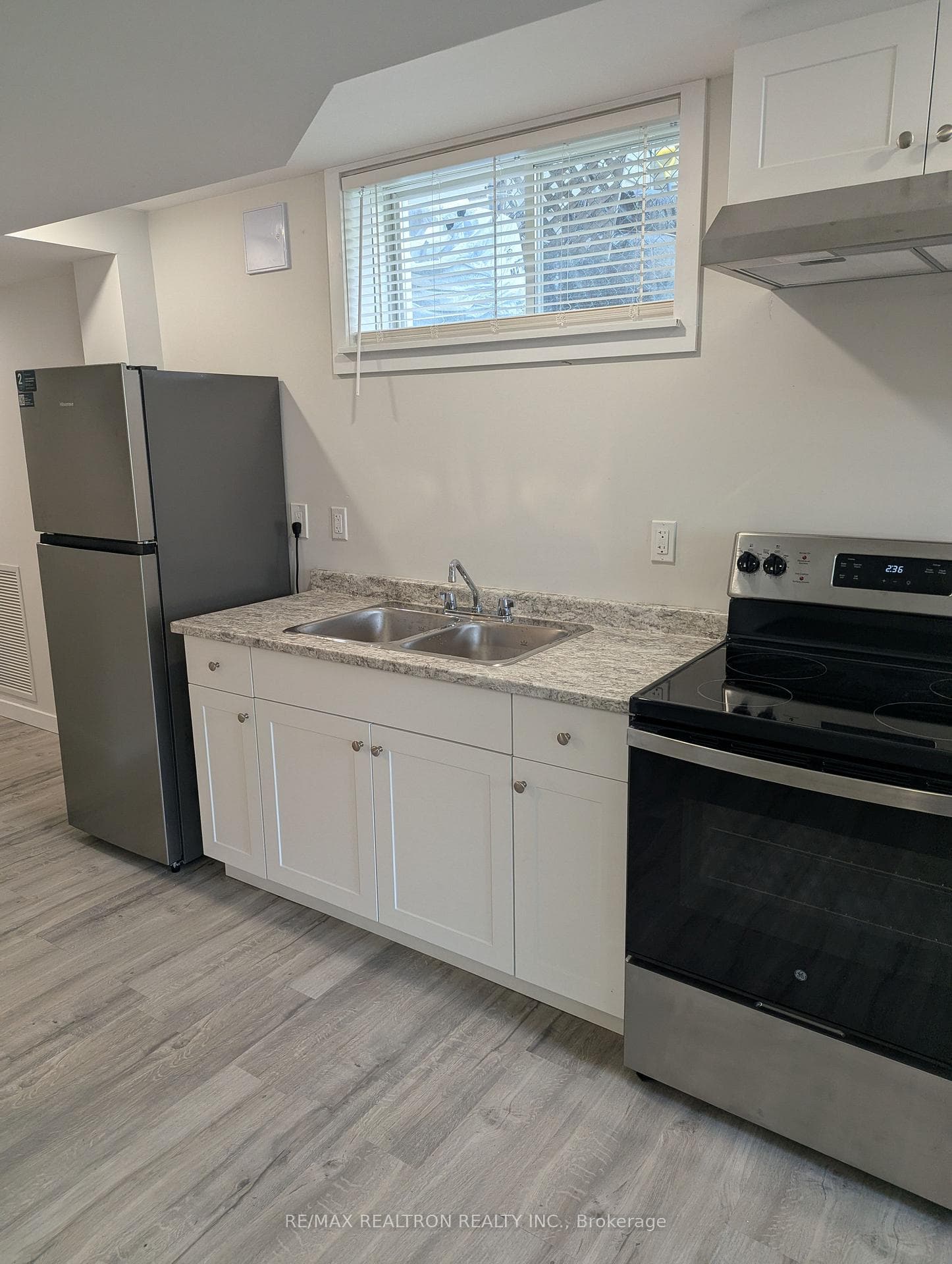 Renovated Kitchen With New Appliances and Cabinets