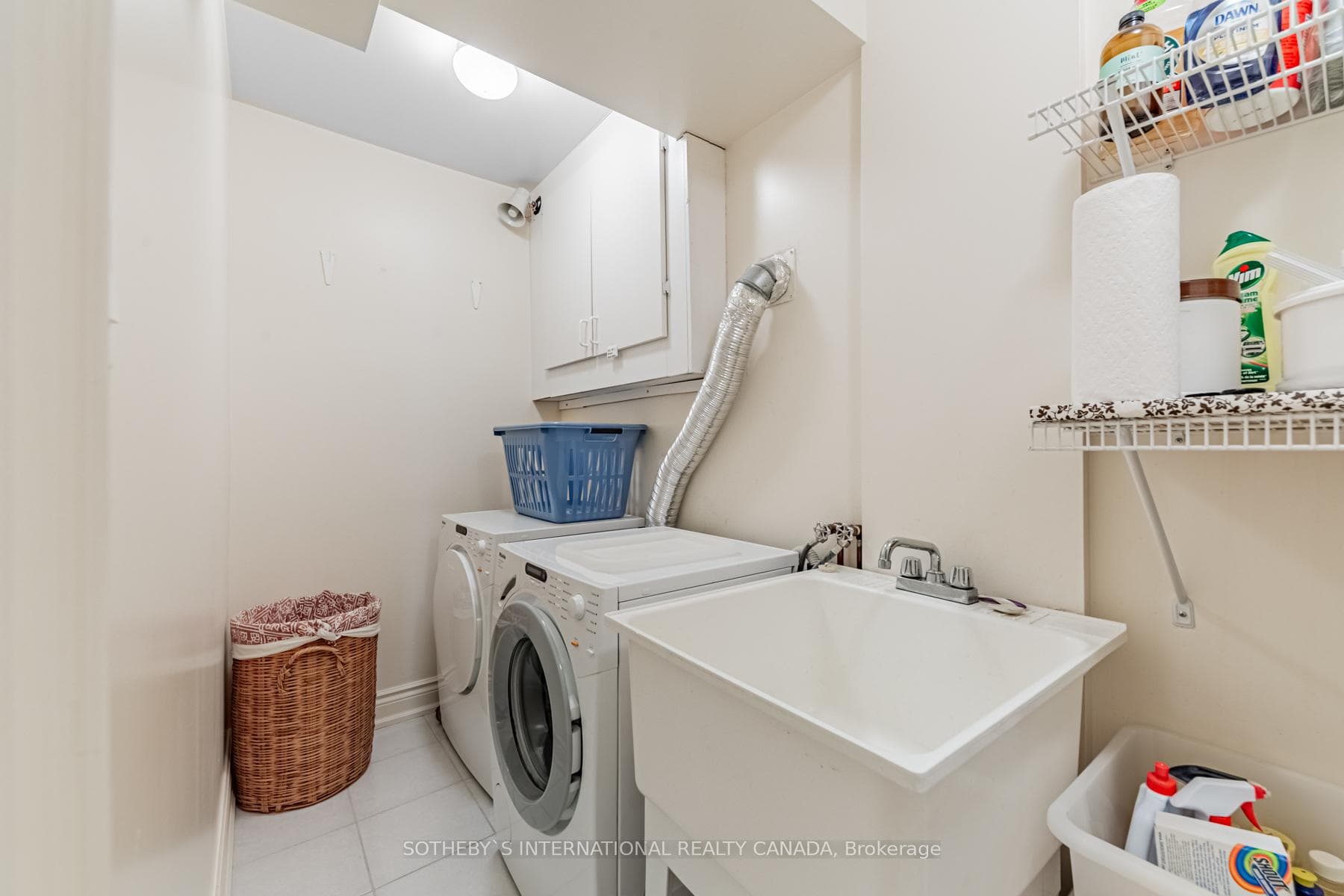 Lower level laundry room with sink